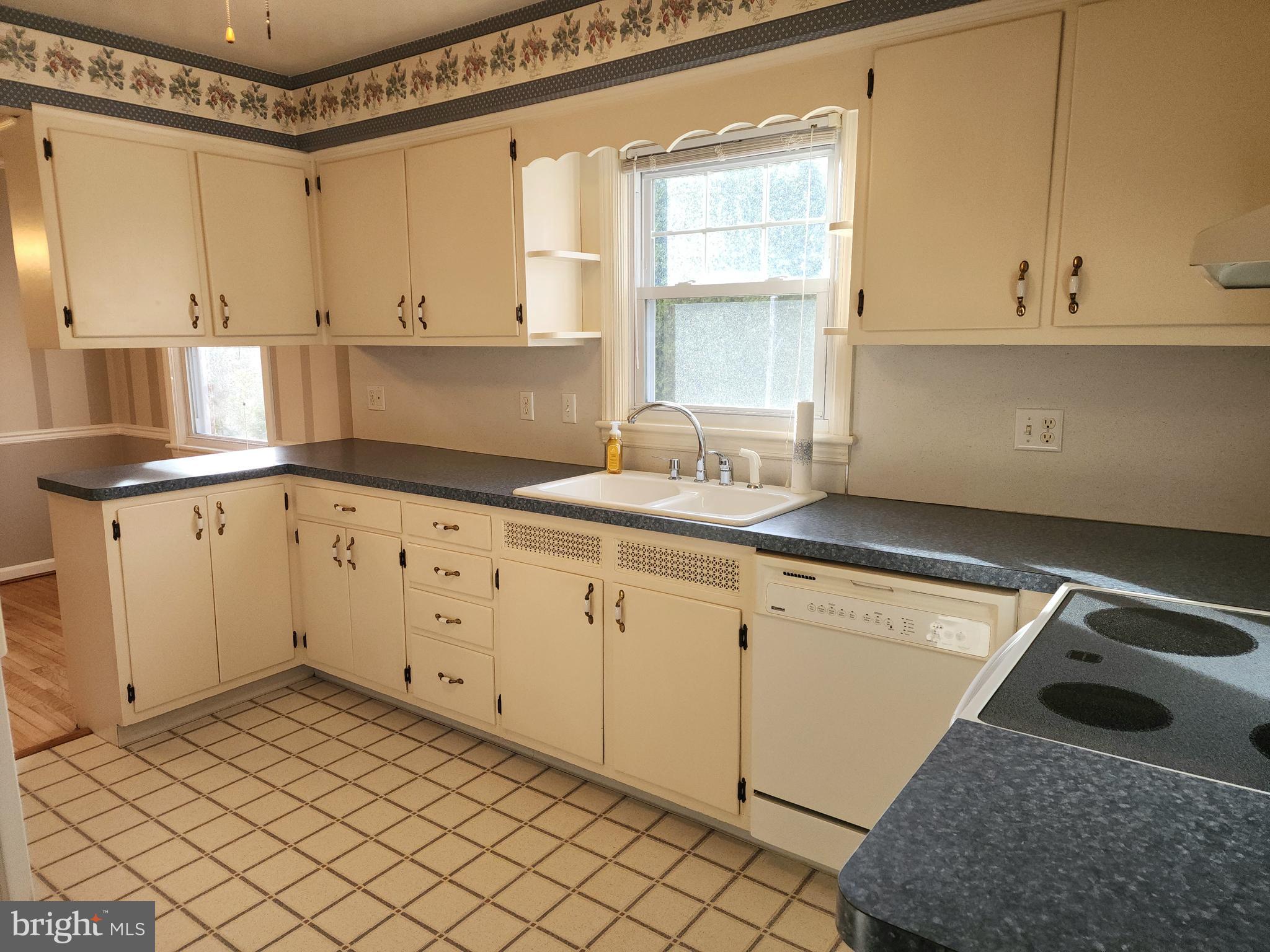 405 Beaumont Road York, PA 17403 - Photo 13 of 30 a kitchen with granite countertop white cabinets and white appliances