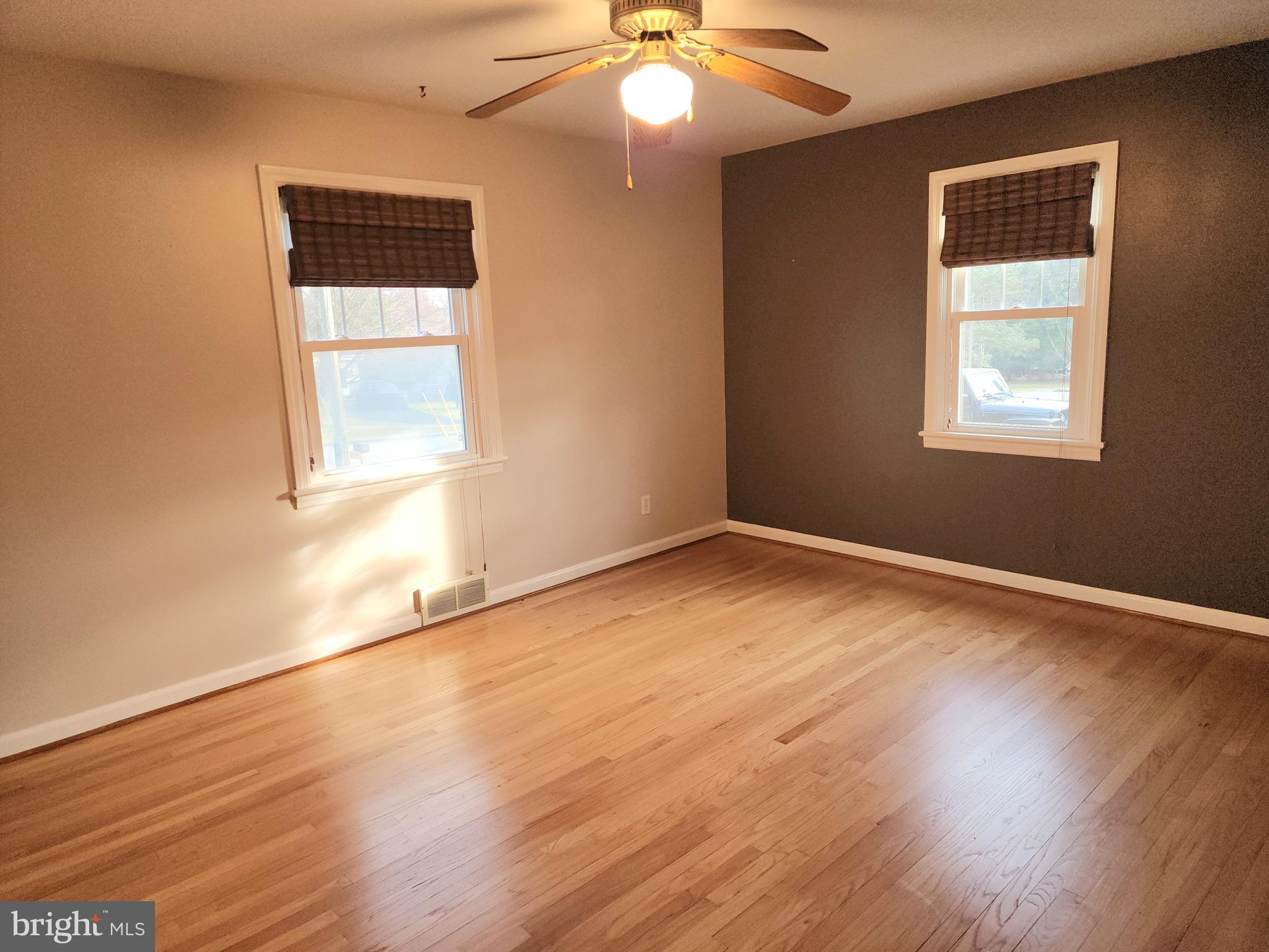 405 Beaumont Road York, PA 17403 - Photo 14 of 30 a view of an empty room with wooden floor and a window