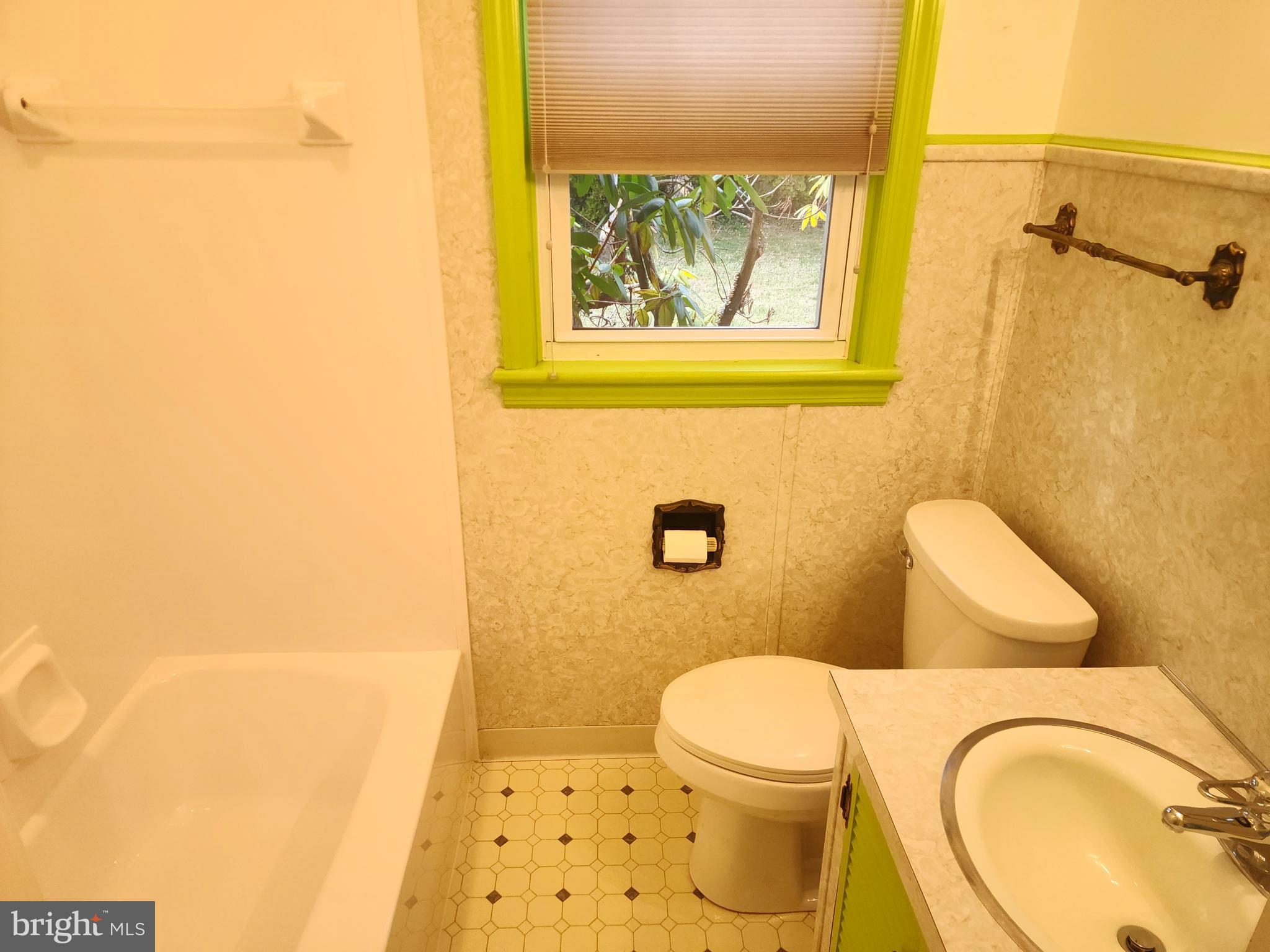 405 Beaumont Road York, PA 17403 - Photo 17 of 30 a white toilet sitting next to a bathroom sink and a mirror