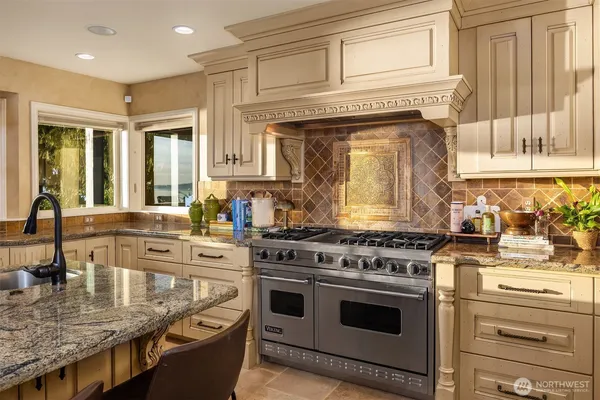 a kitchen with counter top space cabinets and stainless steel appliances