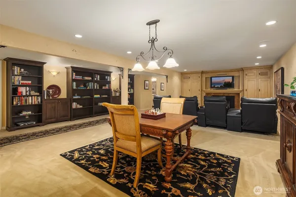 a living room with furniture and flowers
