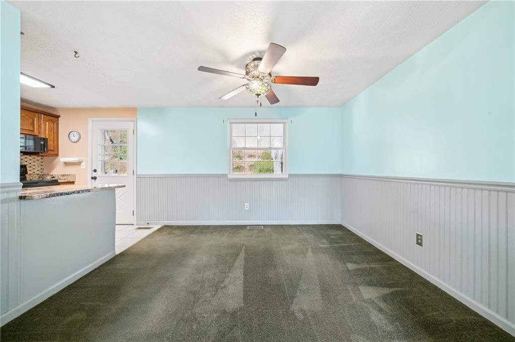 1828 Ivanhoe Drive Irwin, PA 15642 - Photo 11 of 33 wooden floor in an empty room with a window