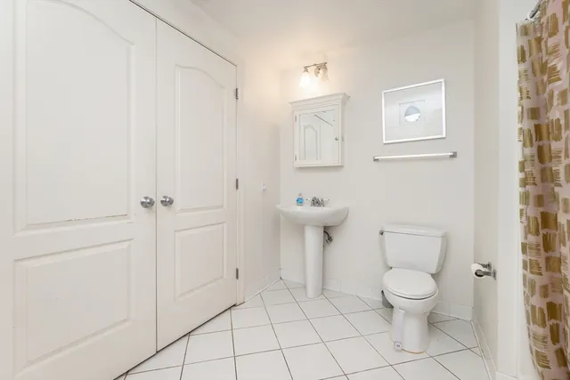 a bathroom with a toilet and a sink