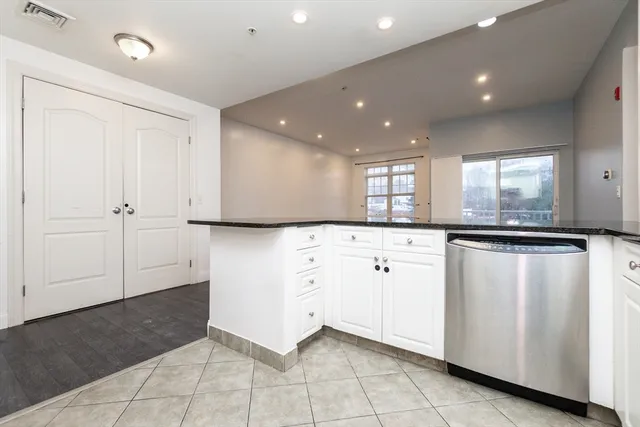 a view of a kitchen with electric appliances
