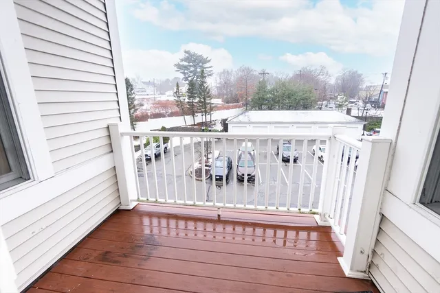 a view of a balcony with furniture