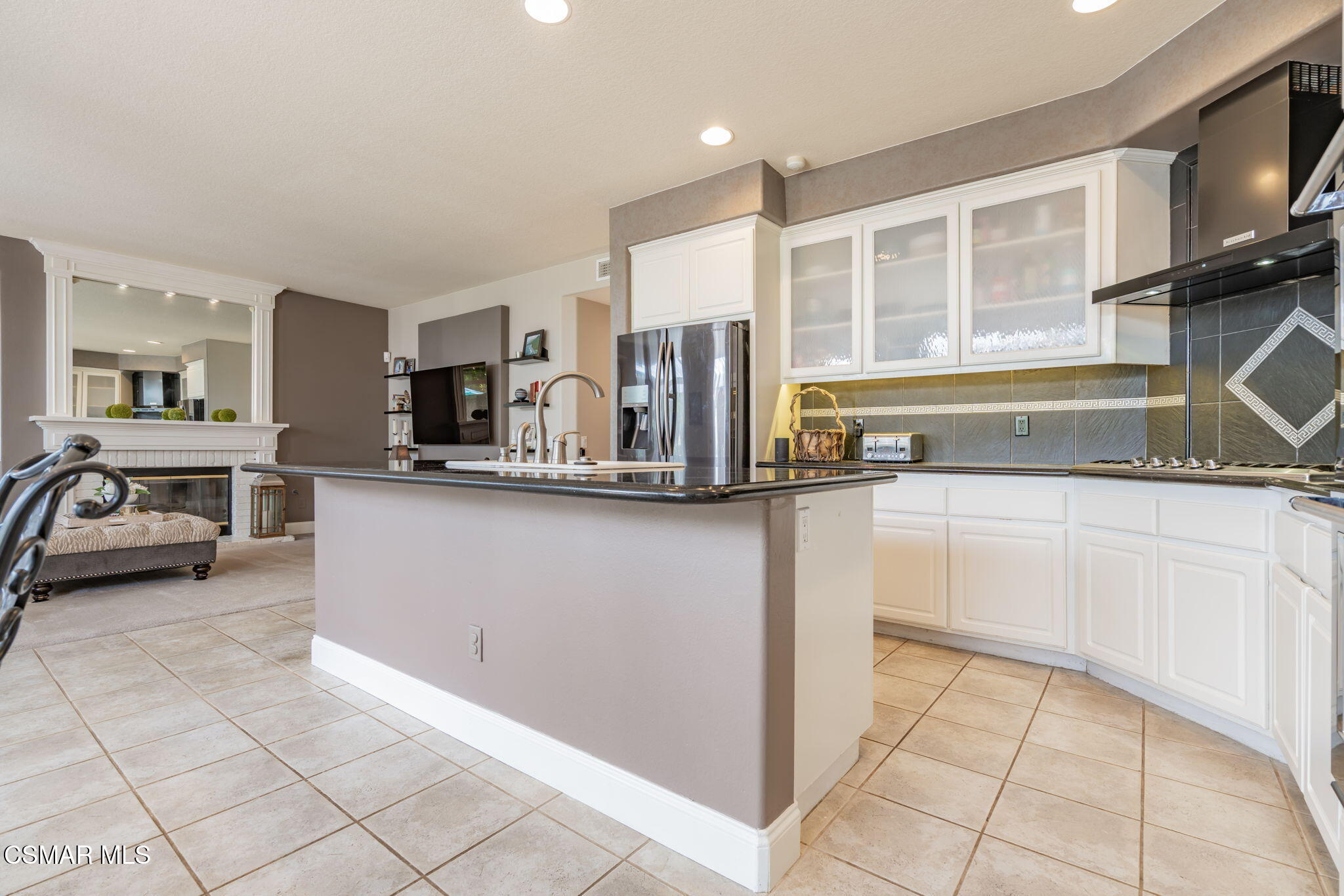 15591 Harte Lane Moorpark, CA 93021 - Photo 13 of 52 a kitchen with stainless steel appliances granite countertop a refrigerator and a sink