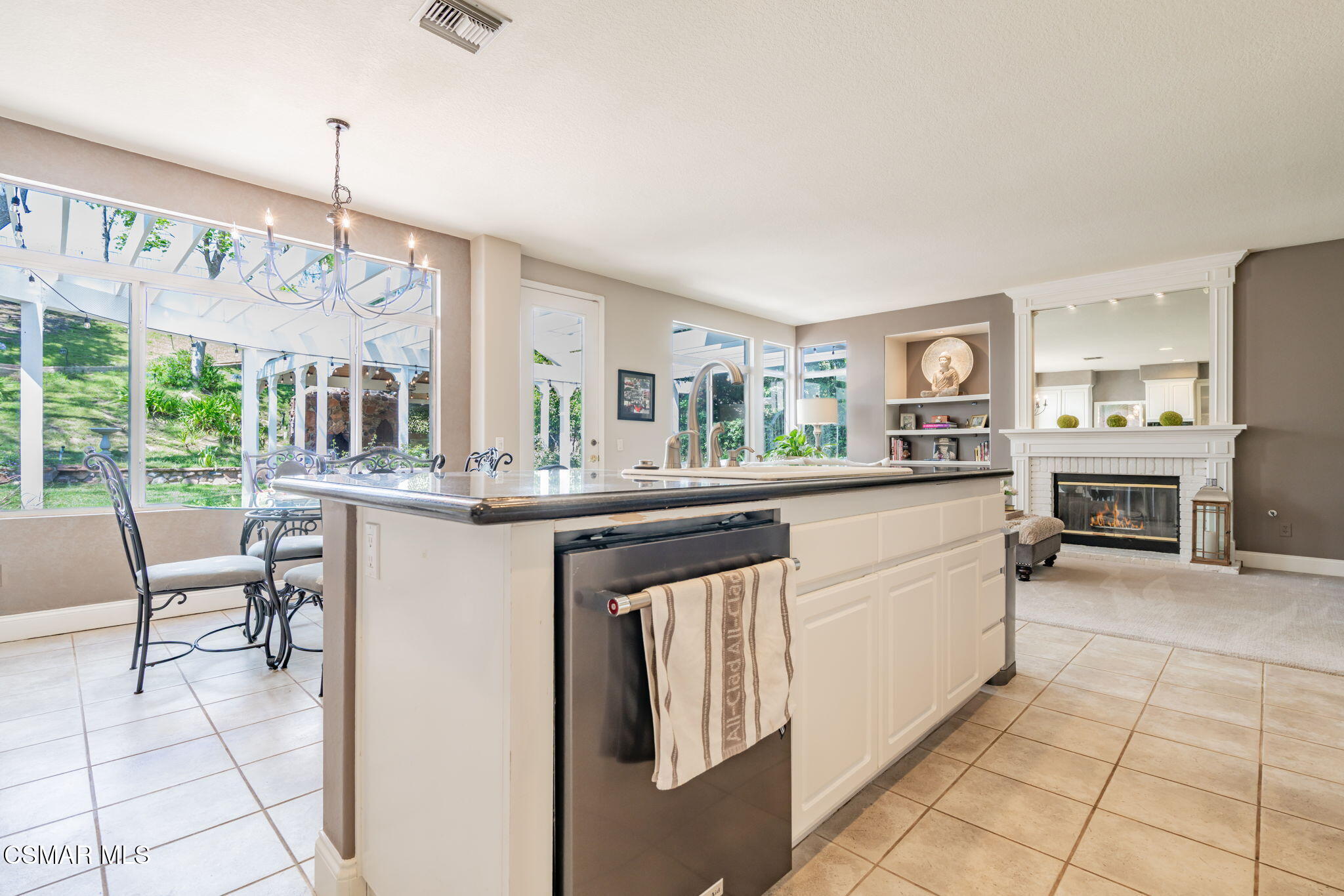 15591 Harte Lane Moorpark, CA 93021 - Photo 14 of 52 a kitchen with stainless steel appliances granite countertop a stove and cabinets