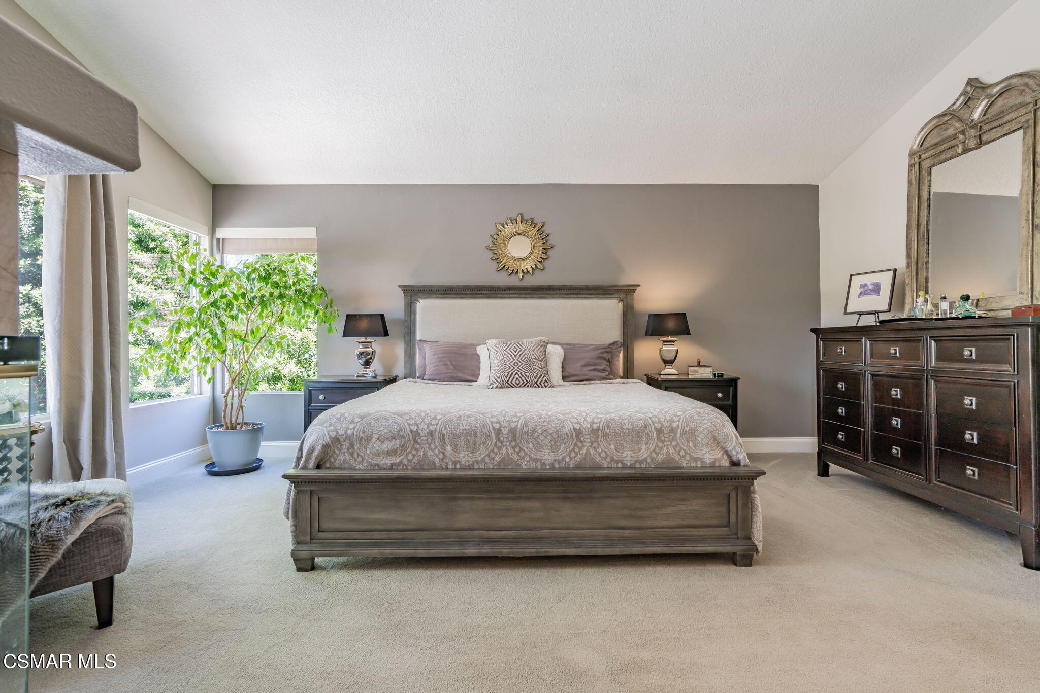 15591 Harte Lane Moorpark, CA 93021 - Photo 17 of 52 a spacious bedroom with a bed and a lamp