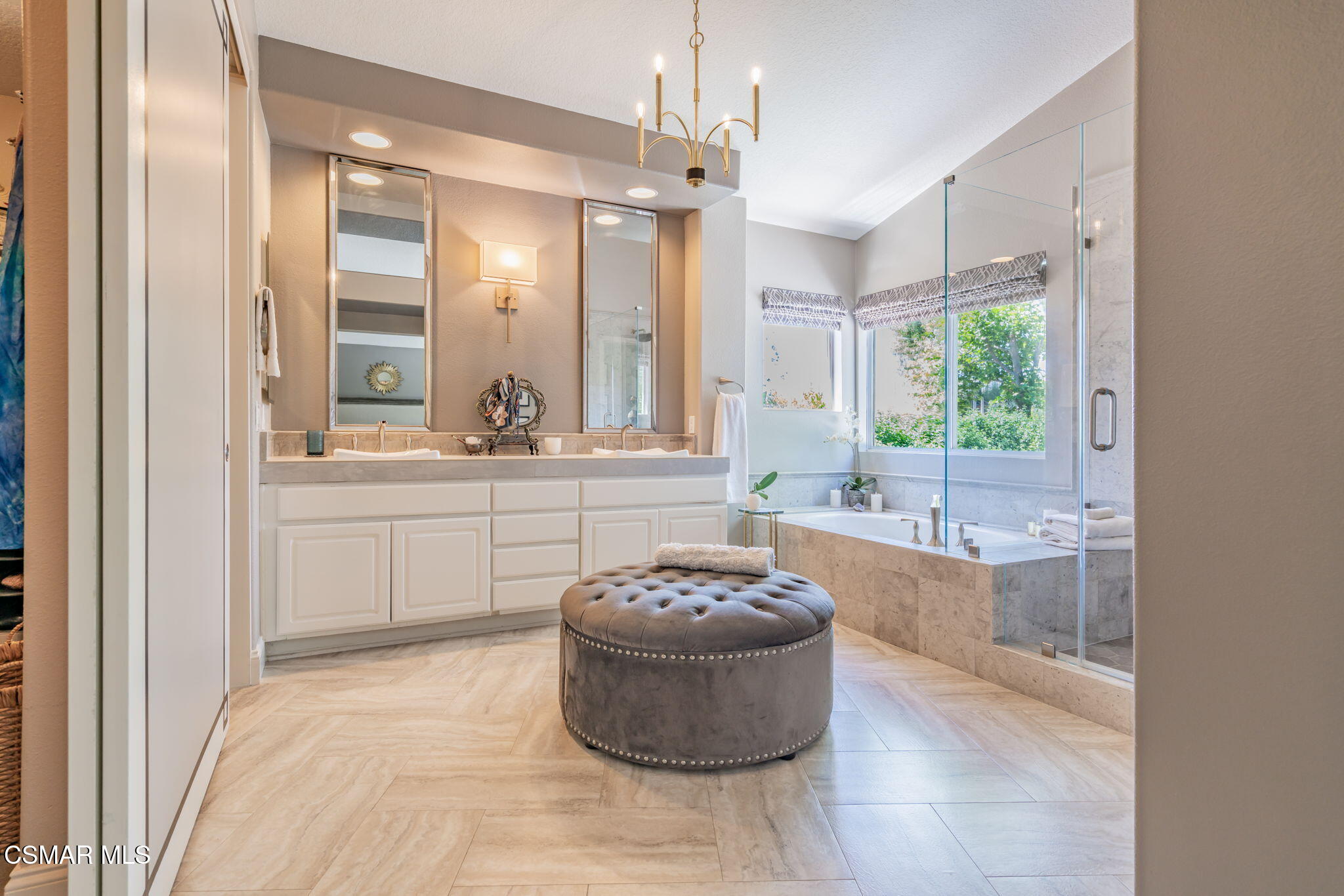 15591 Harte Lane Moorpark, CA 93021 - Photo 19 of 52 a spacious bathroom with a tub sink and mirror