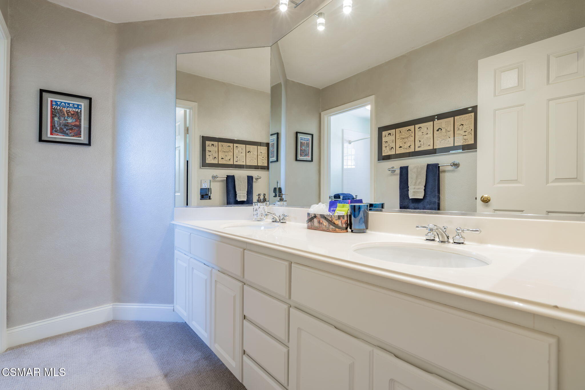 15591 Harte Lane Moorpark, CA 93021 - Photo 26 of 52 a bathroom with a sink and a mirror