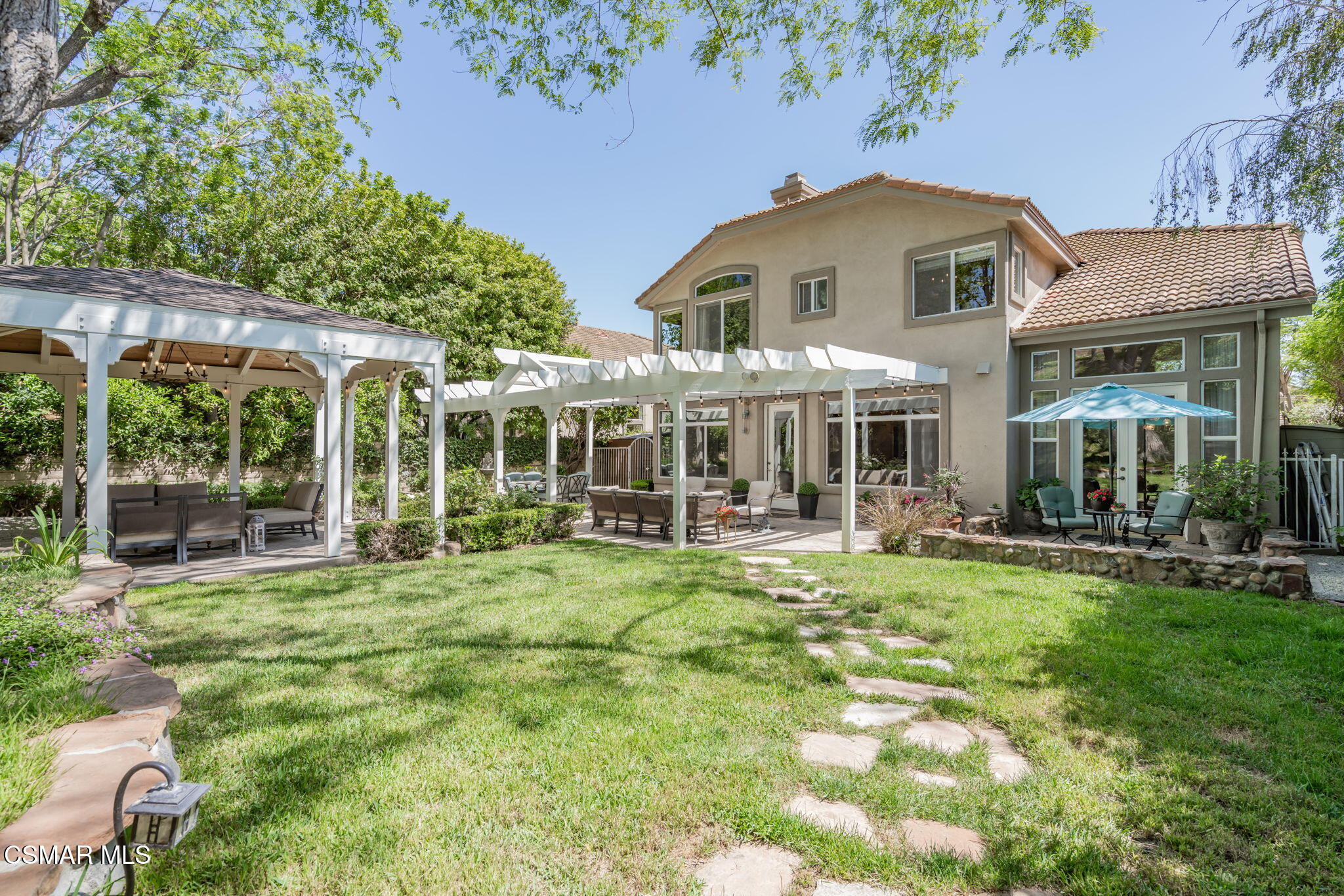 15591 Harte Lane Moorpark, CA 93021 - Photo 41 of 52 a front view of a house with swimming pool having outdoor seating