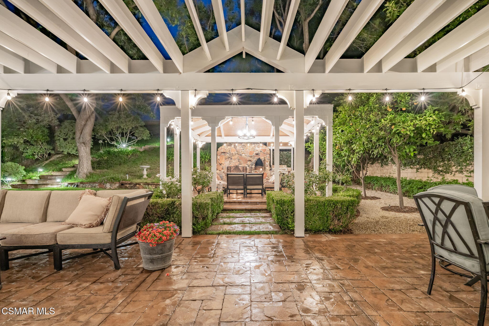 15591 Harte Lane Moorpark, CA 93021 - Photo 47 of 52 a porch with a bench next to a yard