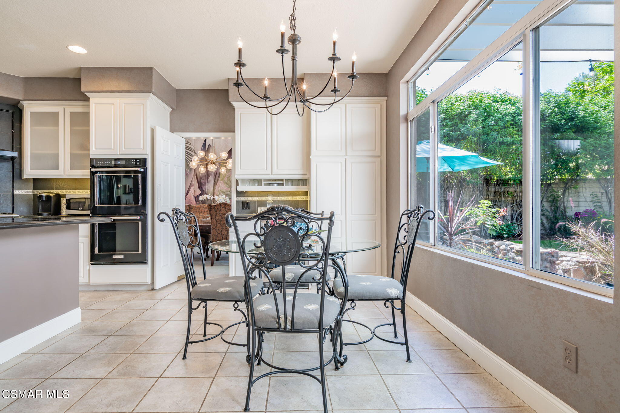 15591 Harte Lane Moorpark, CA 93021 - Photo 9 of 52 a view of a dining room and kitchen with furniture kitchen view and a chandelier