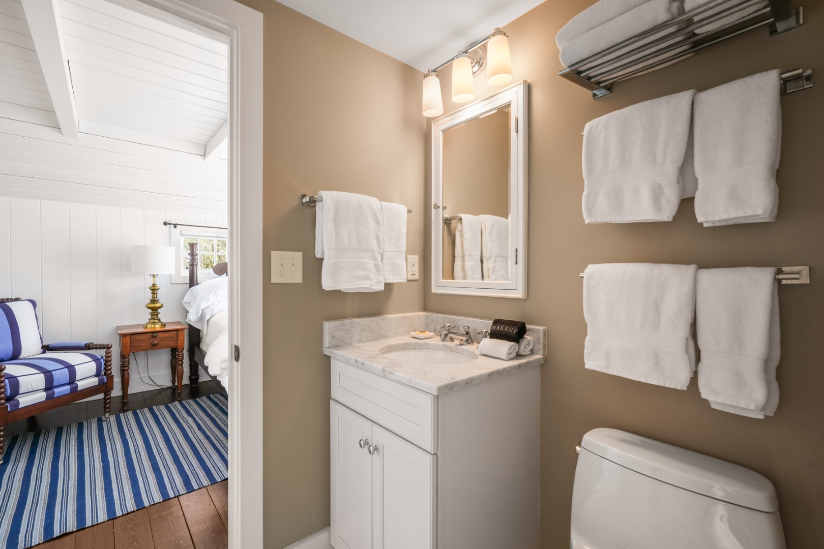 21 Quidnet Road Nantucket, MA 02554 - Photo 20 of 62 a bathroom with a sink toilet and a mirror