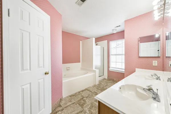 a bath room with a sink and a bath tub