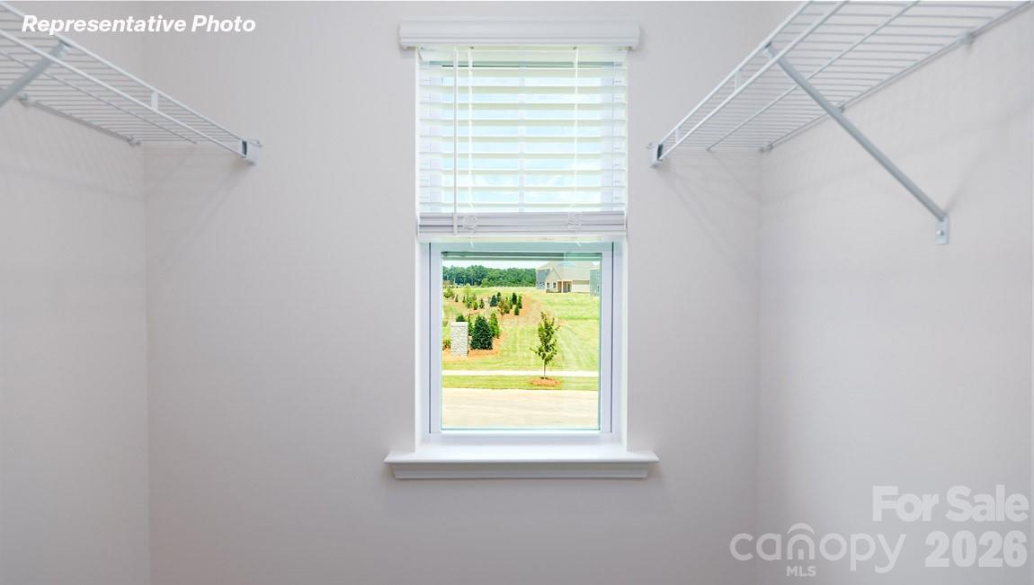 7612 Bainbridge Road Sherrills Ford, NC 28673 - Photo 21 of 37 a bathroom with a window and a shower
