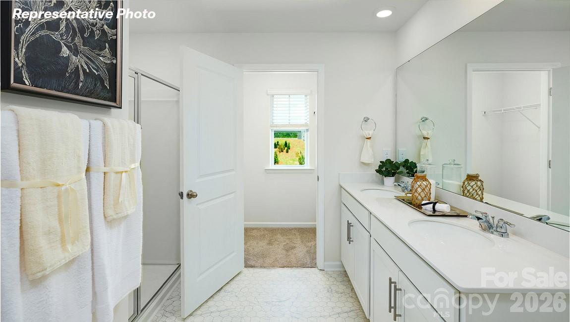 7612 Bainbridge Road Sherrills Ford, NC 28673 - Photo 23 of 37 a bathroom with a granite countertop tub a sink and a large mirror