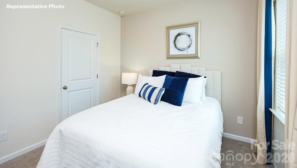 7612 Bainbridge Road Sherrills Ford, NC 28673 - Photo 25 of 37 a bedroom with a bed and a wall painting