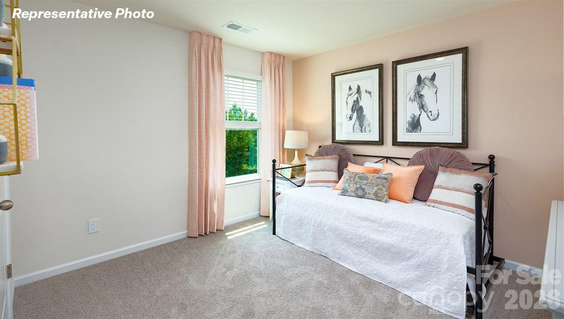 7612 Bainbridge Road Sherrills Ford, NC 28673 - Photo 29 of 37 a bedroom with a large bed and a window