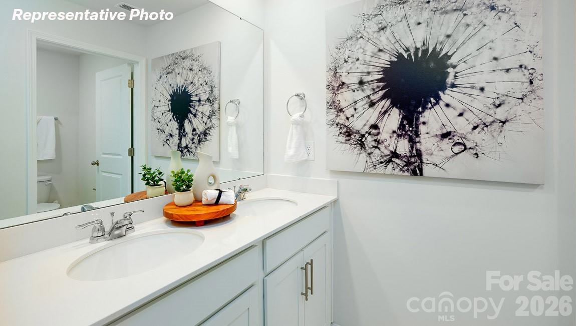 7612 Bainbridge Road Sherrills Ford, NC 28673 - Photo 33 of 37 a bathroom with a sink and a mirror