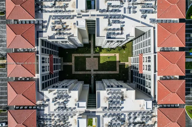 an aerial view of multi story residential apartment building