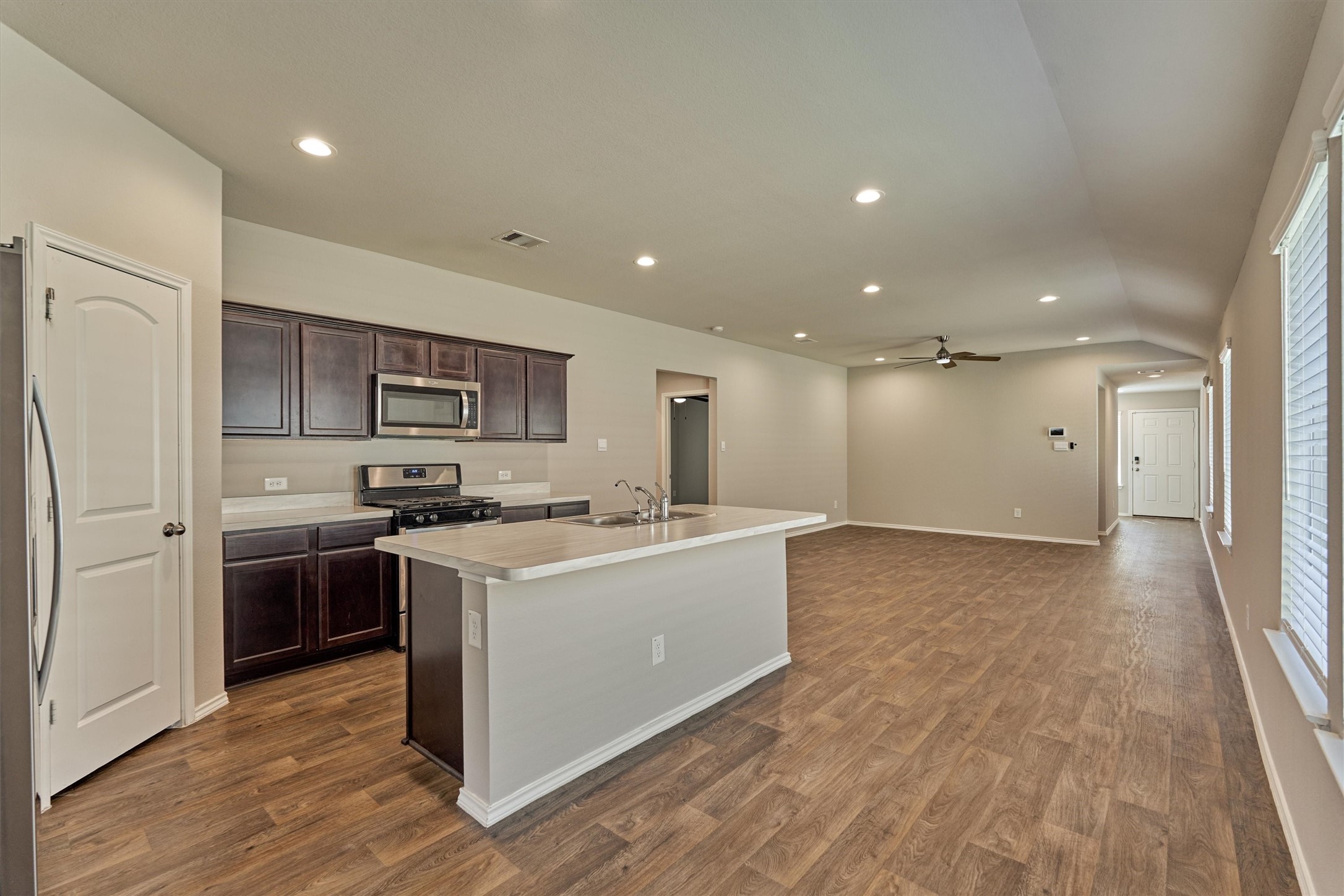 22630 Winter Maple Trail Spring, TX 77373 - Photo 16 of 31 a kitchen with a stove top oven and refrigerator
