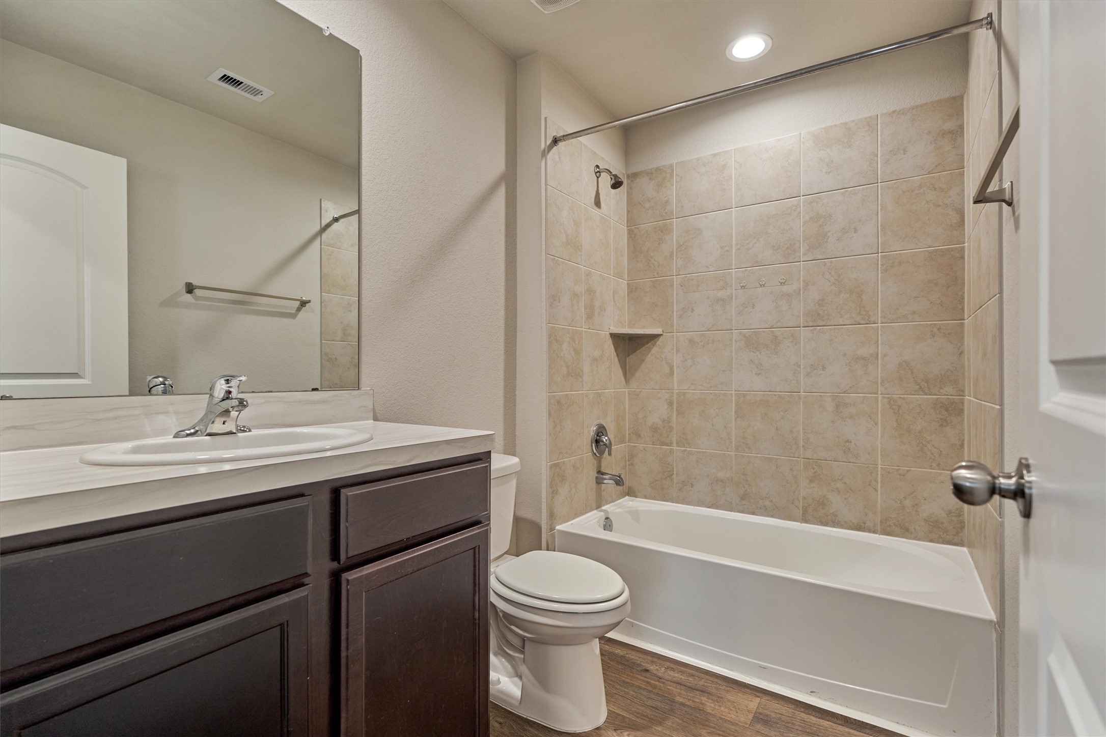 22630 Winter Maple Trail Spring, TX 77373 - Photo 25 of 31 a bathroom with a granite countertop sink toilet and shower