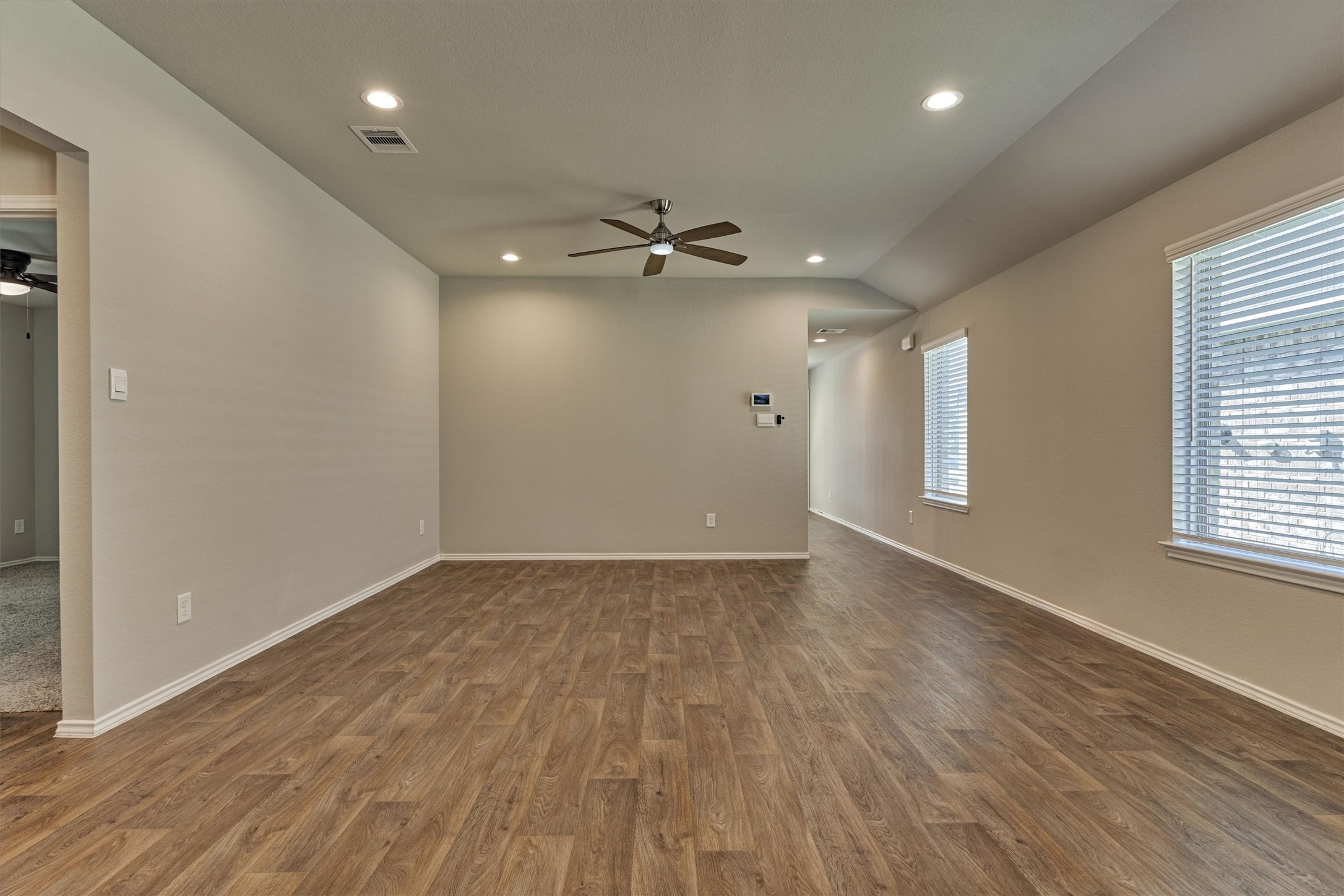 22630 Winter Maple Trail Spring, TX 77373 - Photo 9 of 31 wooden floor in an empty room with a window