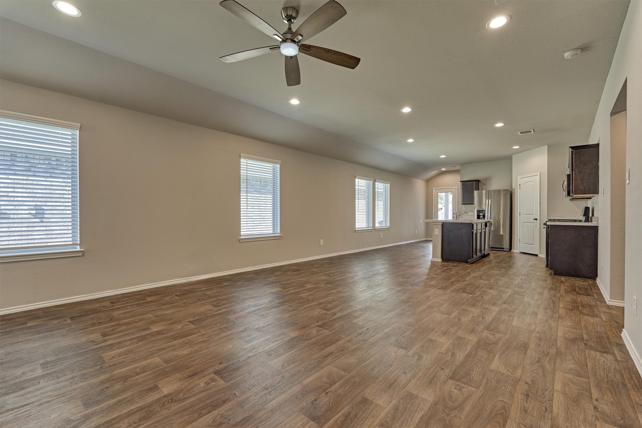 22630 Winter Maple Trail Spring, TX 77373 - Photo 10 of 31 a view of an empty room with a window and wooden floor
