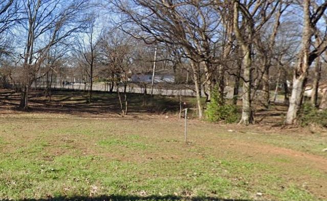 321 Harrell Street Memphis, TN 38112 - Photo 2 of 2 a view of a yard with wooden fence