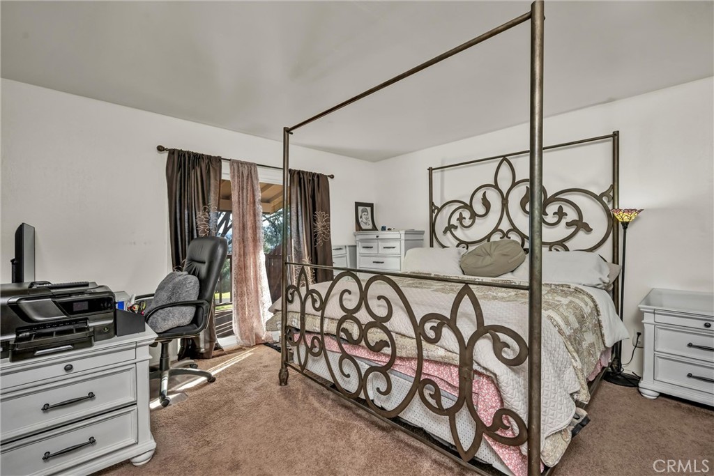 16593 Buckhorn Road Hidden Valley Lake, CA 95467 - Photo 9 of 27 Primary bedroom has door to deck.