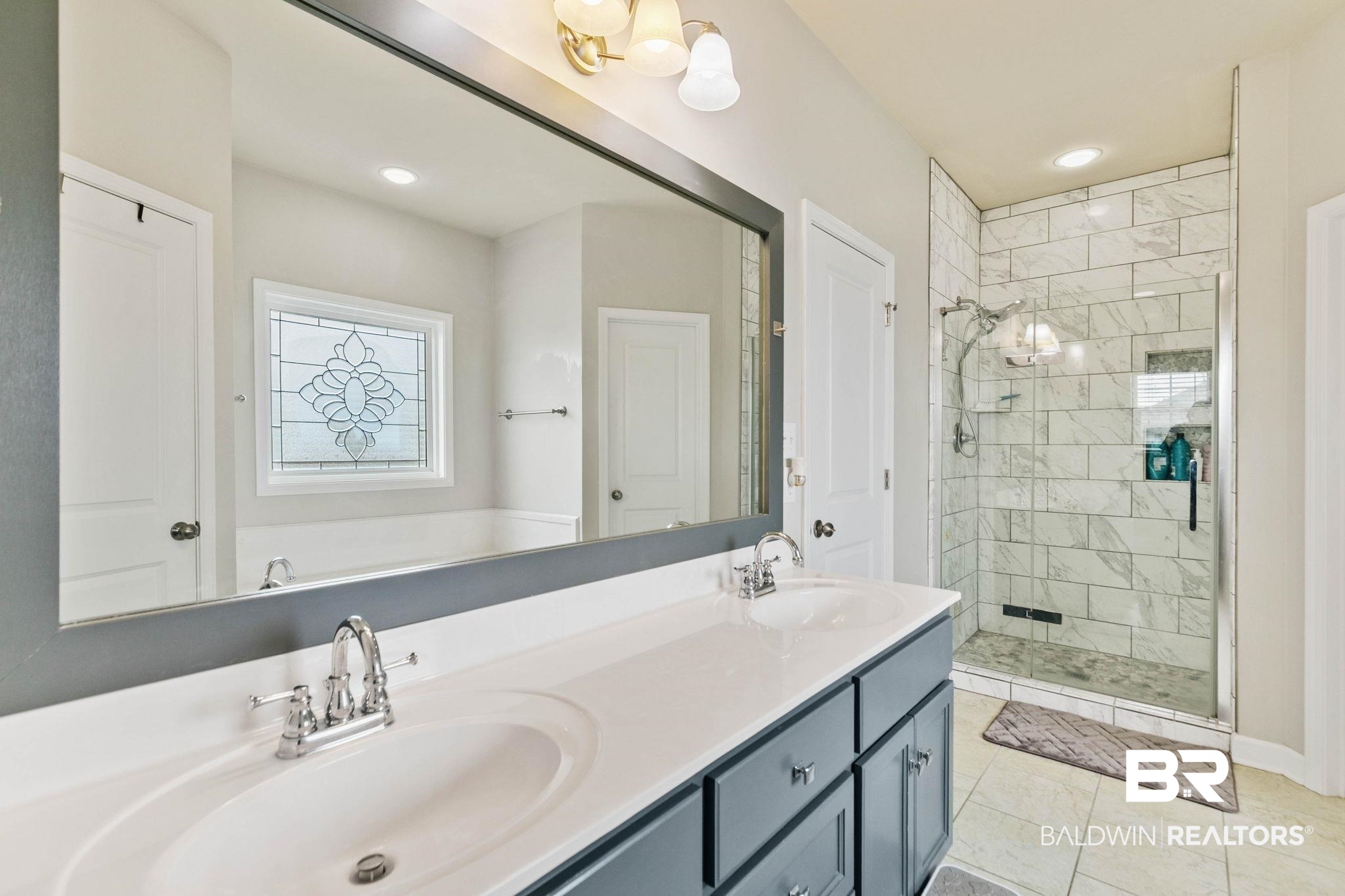 9177 Labrador Trail Theodore, AL 36582 - Photo 20 of 24 Full bath featuring double vanity, a stall shower, recessed lighting, and light tile patterned floors