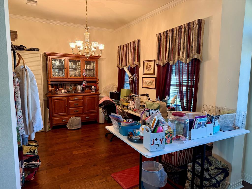 1333 East Highland Road Waxahachie, TX 75167 - Photo 8 of 33 a view of a dining room with furniture and chandelier