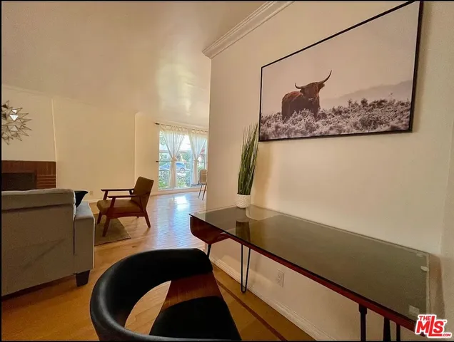 a view of a living room and dining room