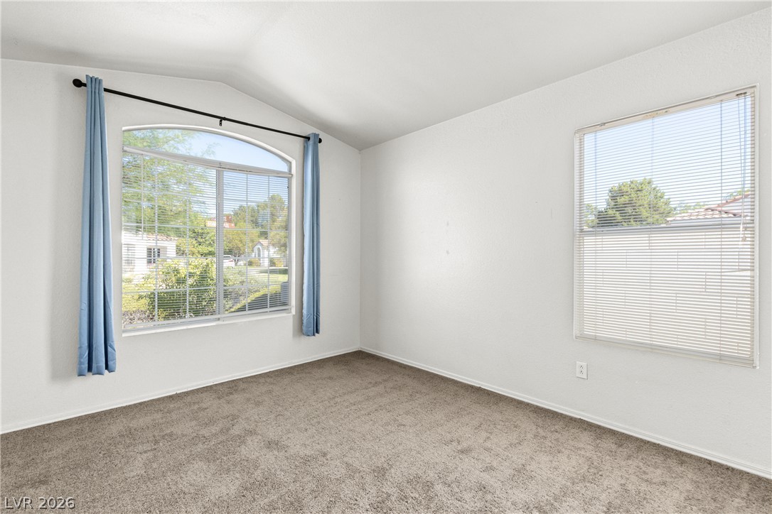 1815 Stablegate Avenue Henderson, NV 89012 - Photo 11 of 28 Natural light floods this inviting room through an elegant arched window.