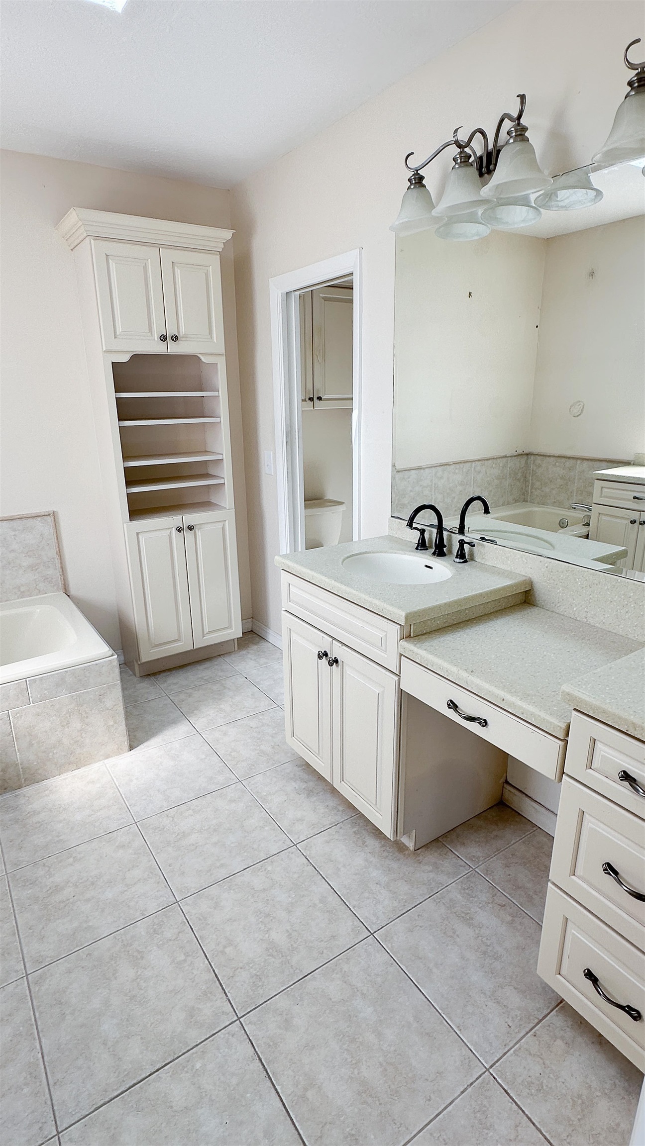 2 11th Street St. Augustine Beach, FL 32080 - Photo 5 of 72 Full bath featuring a garden tub, vanity, and light tile patterned floors