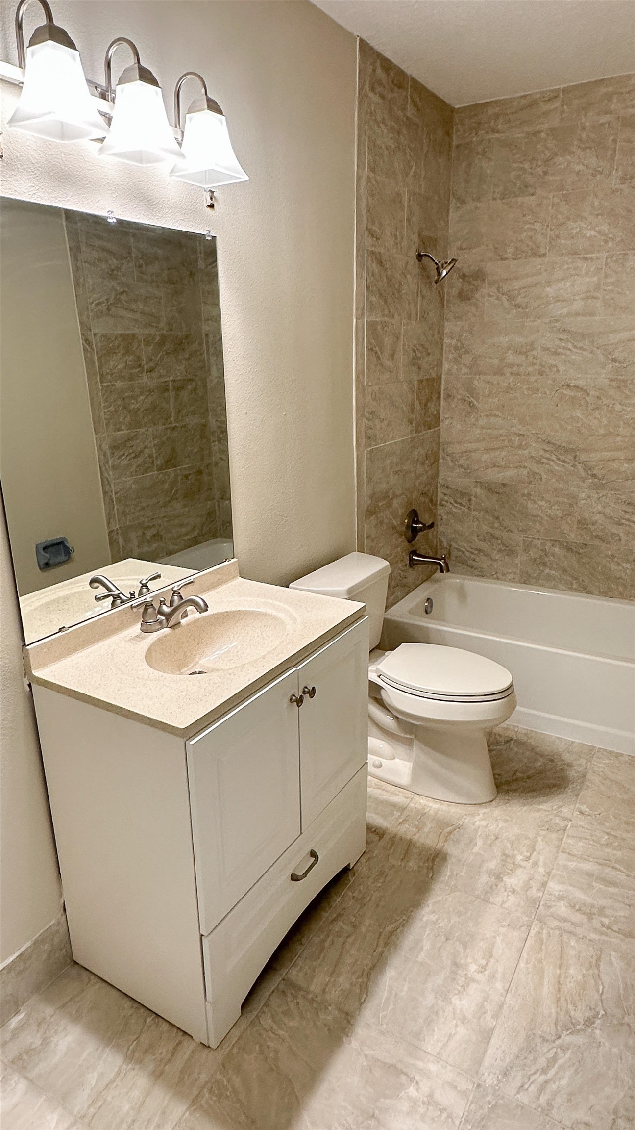 2 11th Street St. Augustine Beach, FL 32080 - Photo 70 of 72 a bathroom with a granite countertop sink toilet and shower