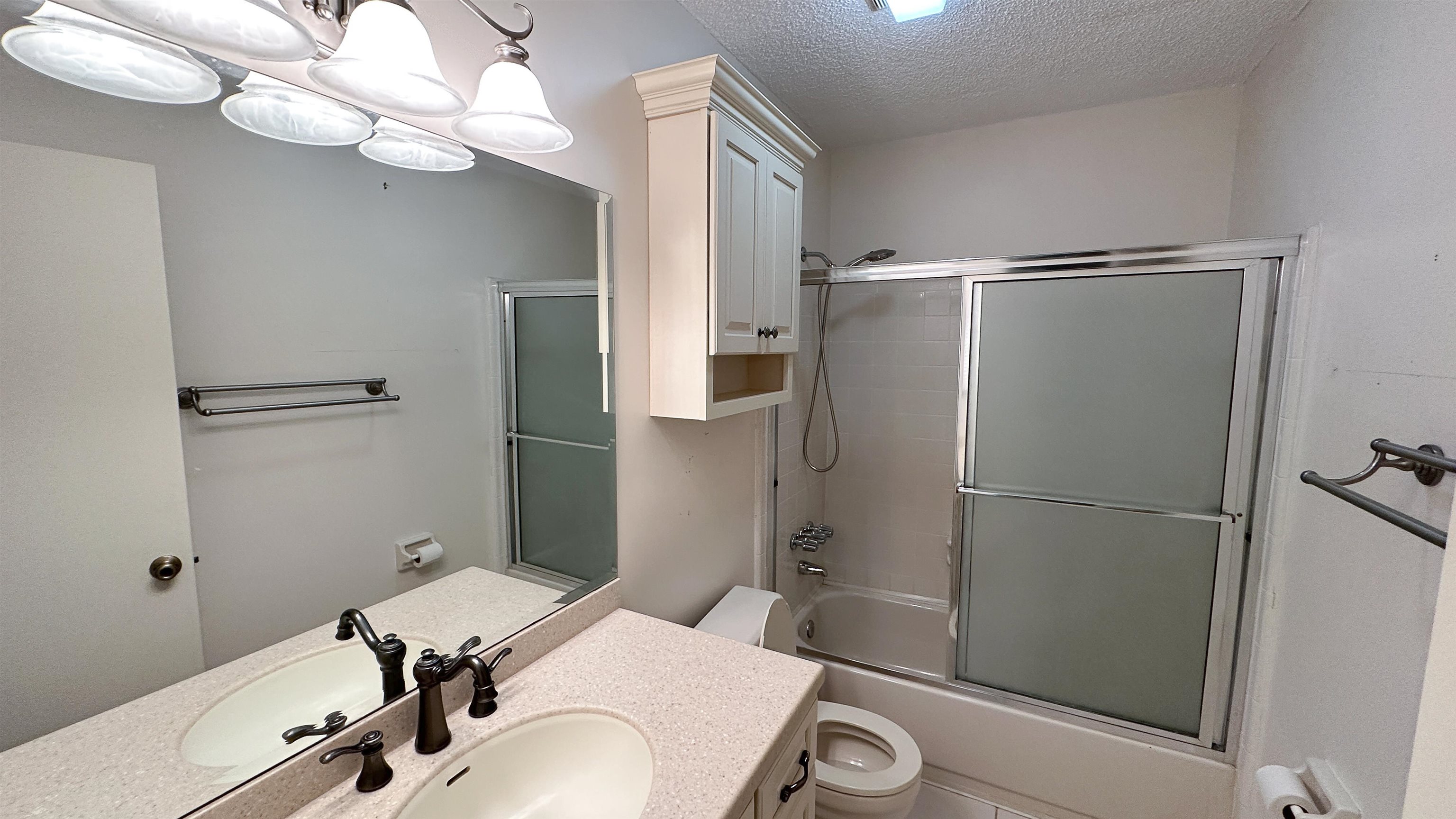 2 11th Street St. Augustine Beach, FL 32080 - Photo 71 of 72 a bathroom with a sink a mirror and a shower