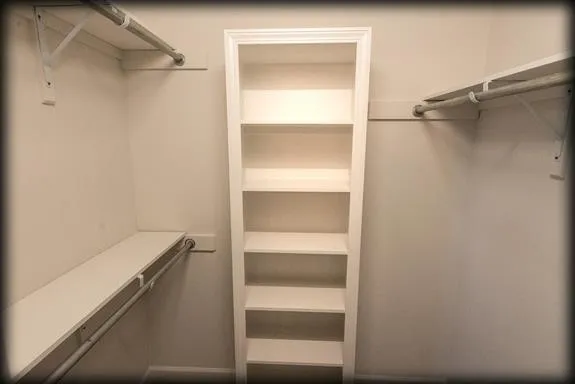 a view of an empty walk in closet