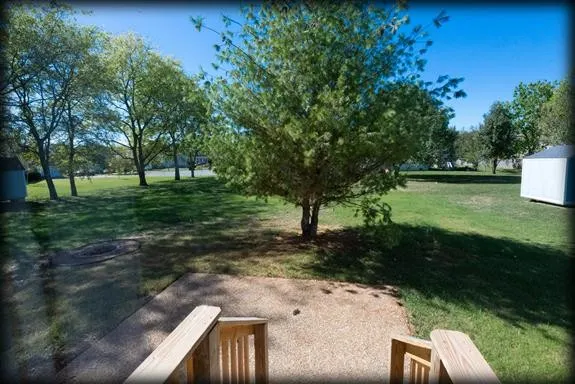 a view of backyard with green space
