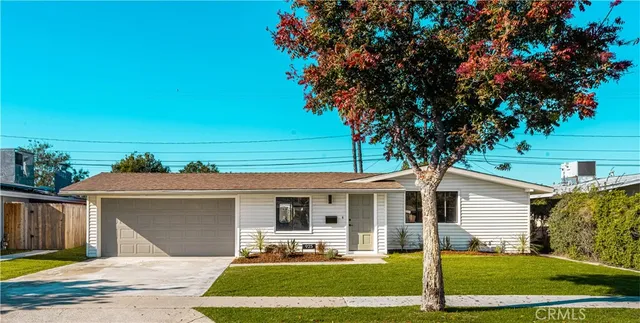 a front view of a house with garden and porch