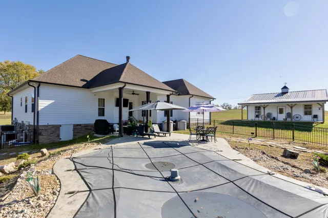 an outdoor space with furniture and umbrella