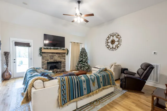 a kitchen with kitchen island granite countertop a sink counter top space appliances and cabinets
