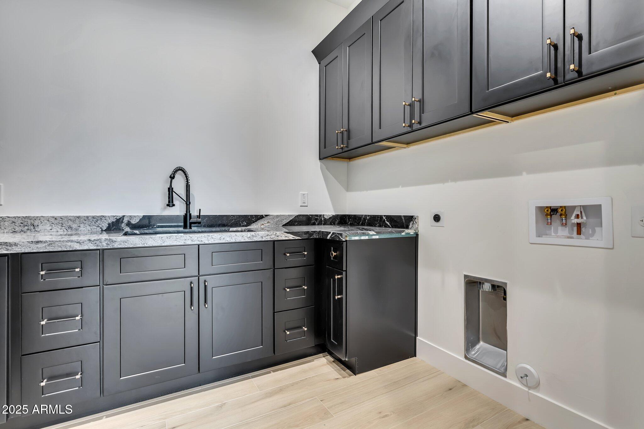 1602 East Cloud Road Phoenix, AZ 85086 - Photo 36 of 45 a kitchen with a sink and cabinets