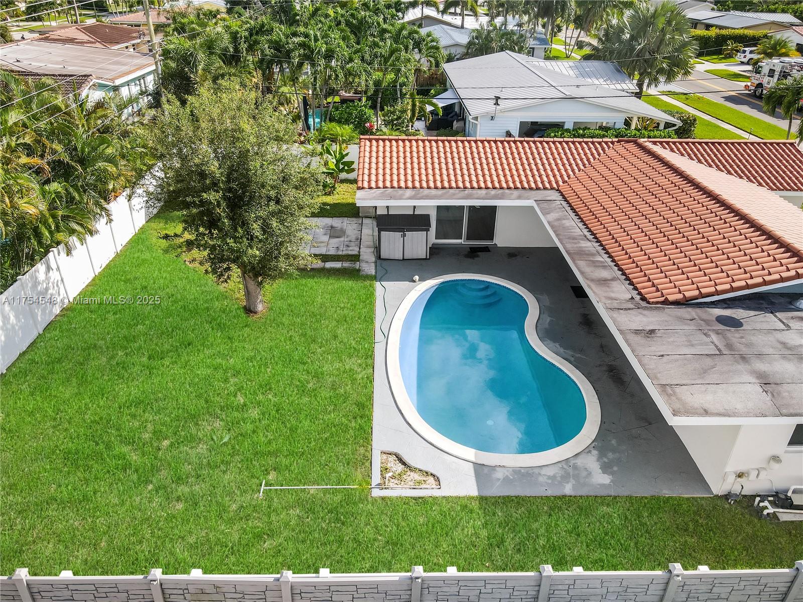 28 Southwest 9th Avenue Boca Raton, FL 33486 - Photo 4 of 27 an aerial view of a house with garden space and deck