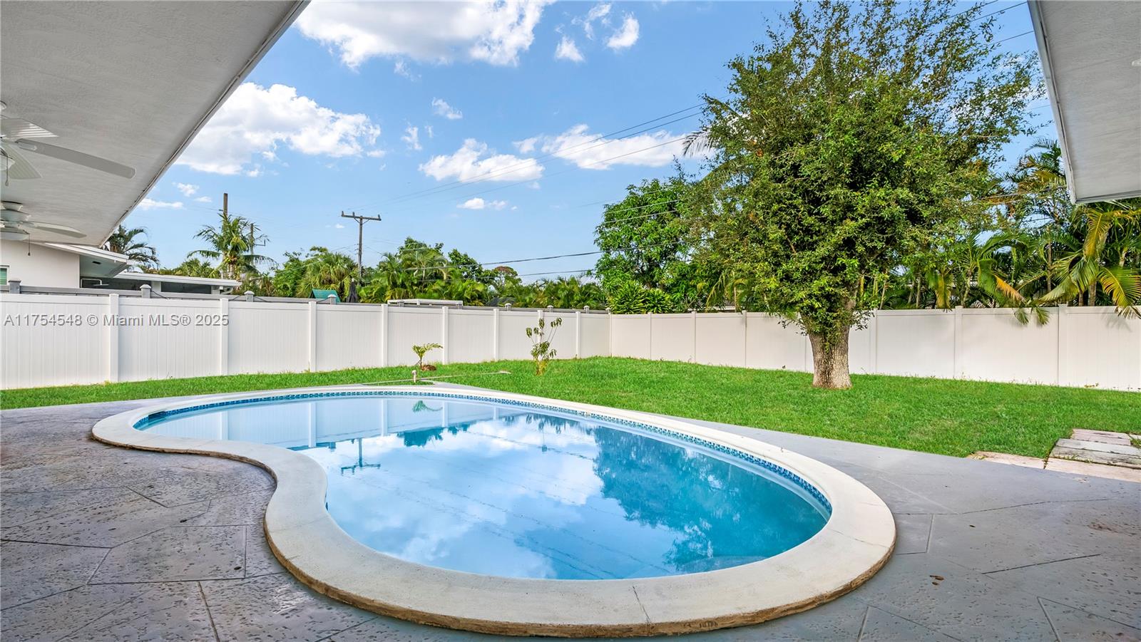 28 Southwest 9th Avenue Boca Raton, FL 33486 - Photo 5 of 27 a view of a swimming pool with a yard