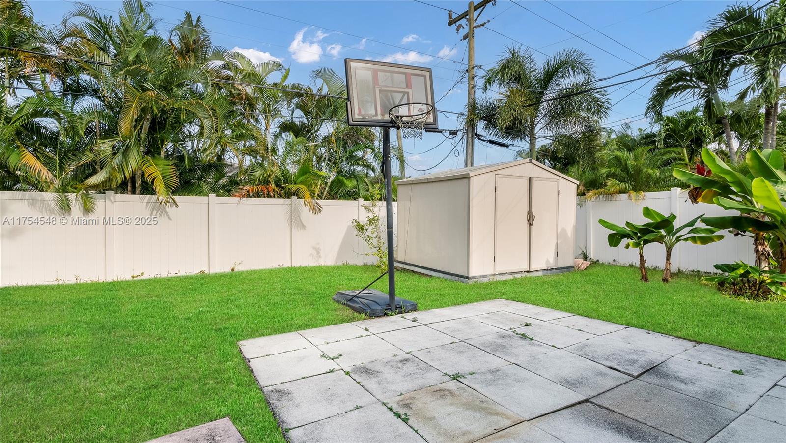 28 Southwest 9th Avenue Boca Raton, FL 33486 - Photo 7 of 27 a white house with a yard and plants