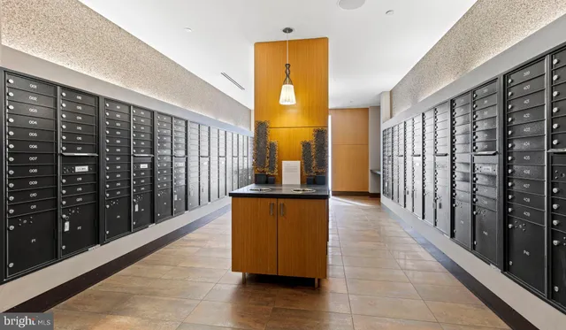 a view of a storage and utility room with washer and dryer