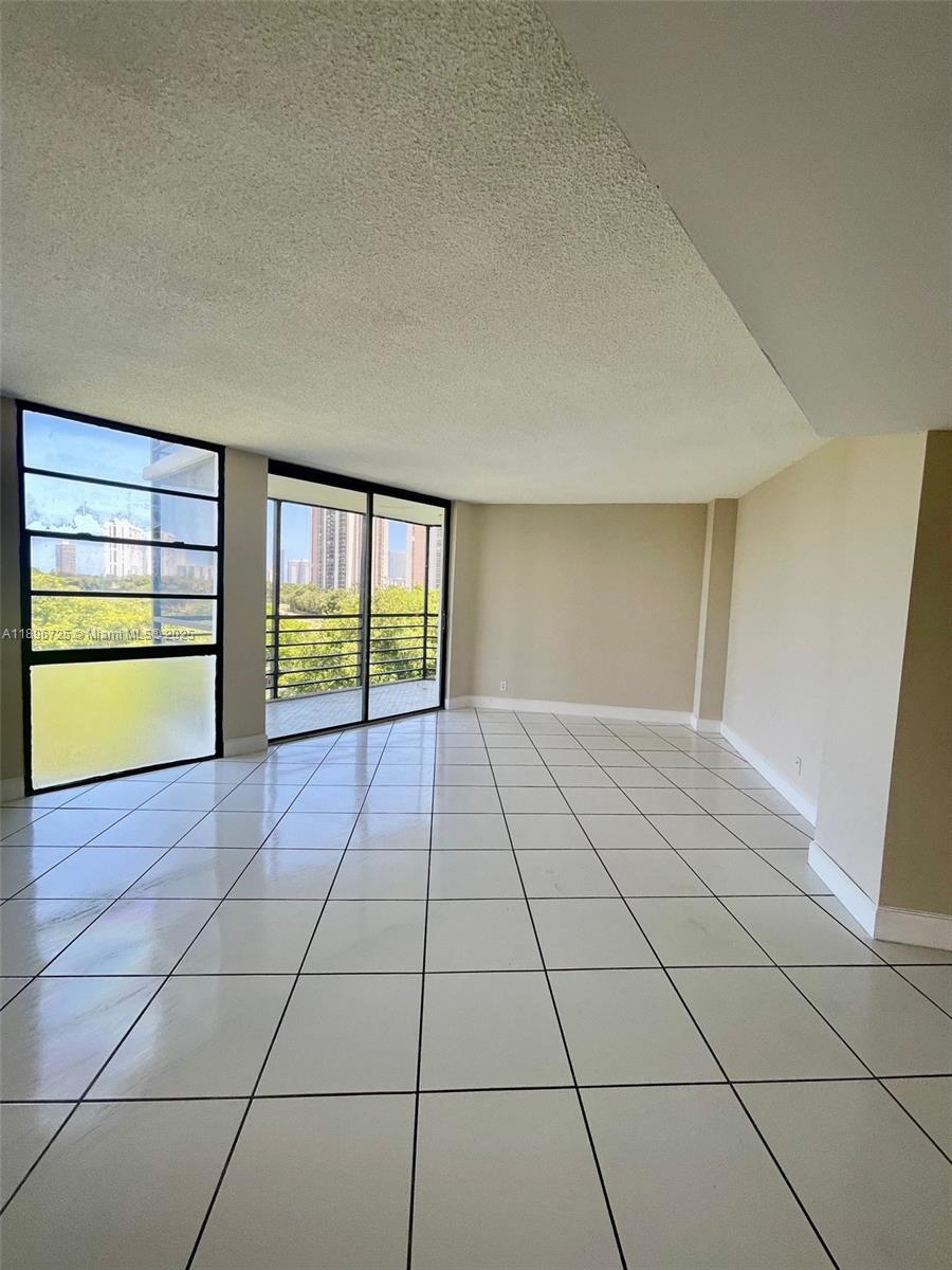 20400 West Country Club Drive, Unit 608 Aventura, FL 33180 - Photo 14 of 19 a view of an empty room with a window