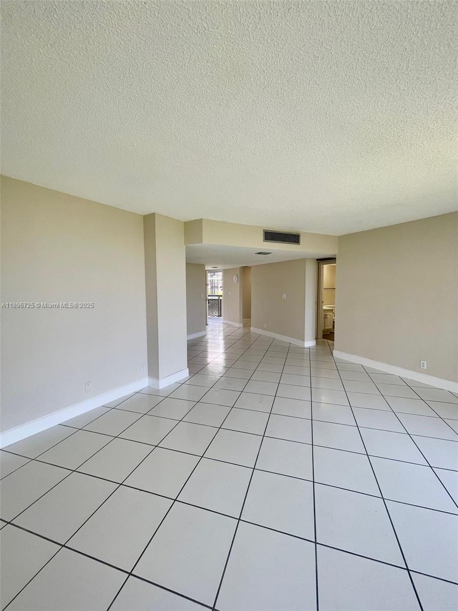 20400 West Country Club Drive, Unit 608 Aventura, FL 33180 - Photo 17 of 19 a view of an empty room and window
